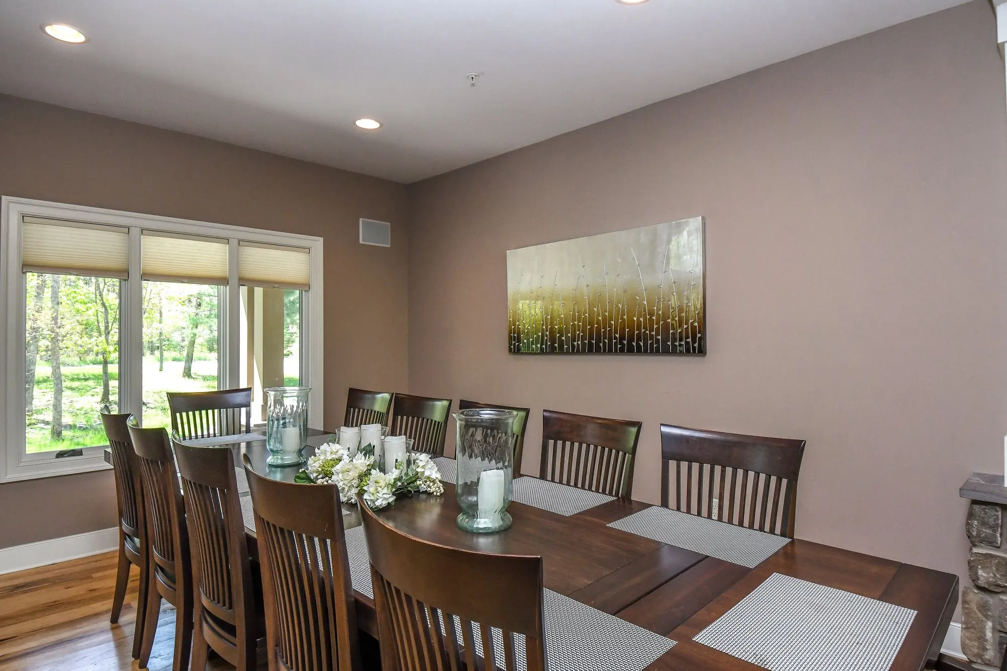 Dining table beside the windows at Woodland Chalet