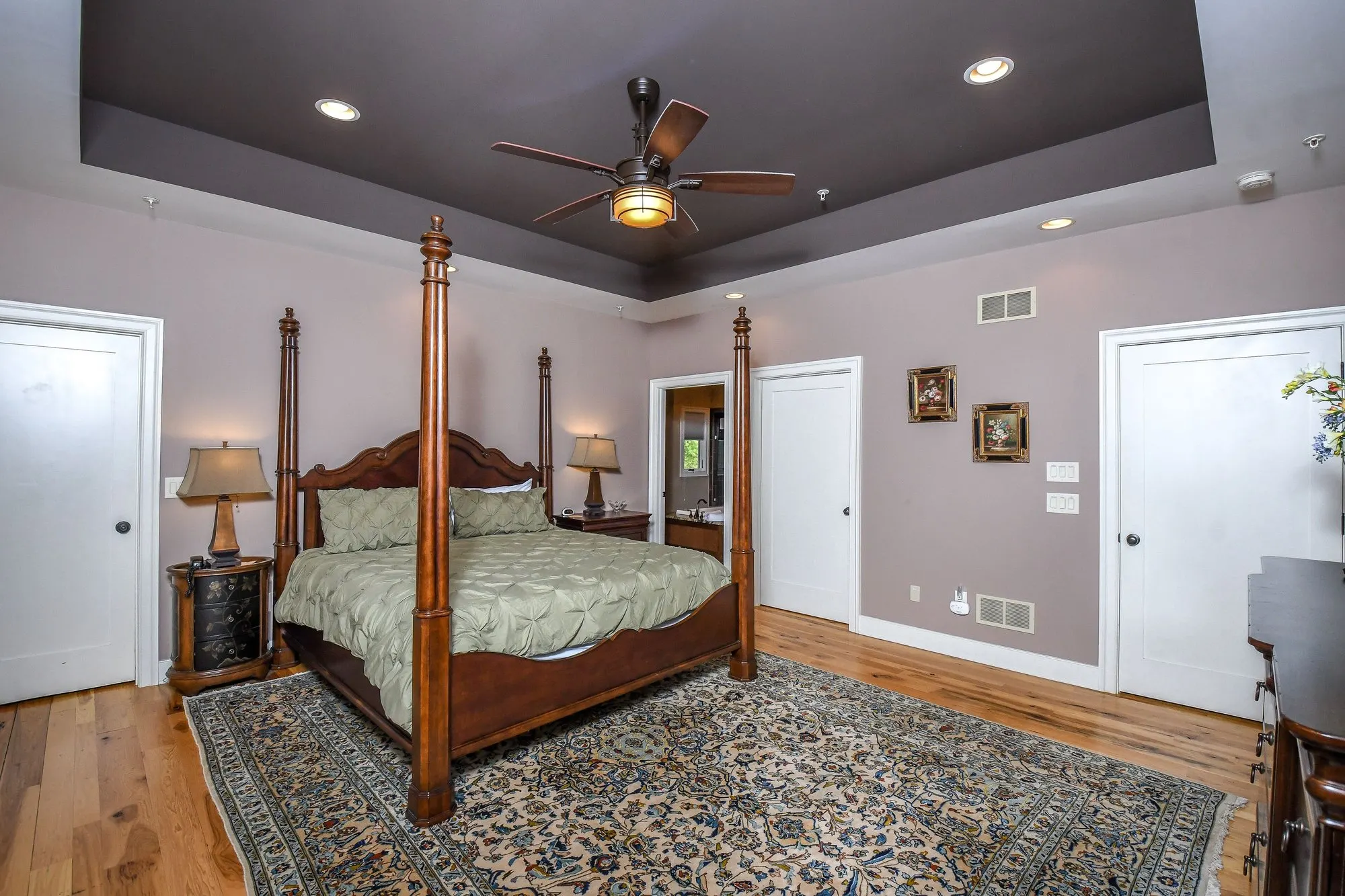 Primary suite bedroom with a king bed at Woodland Chalet