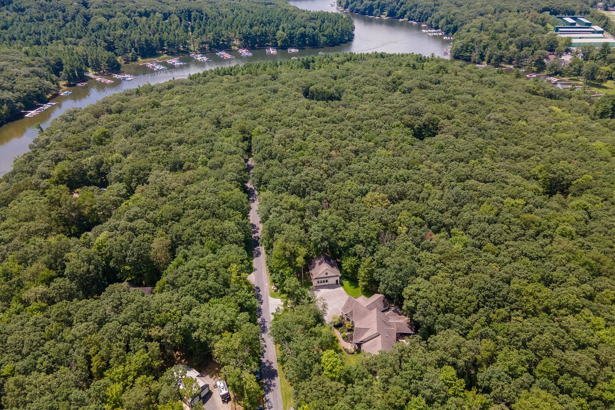 Aerial perspective of Woodland Chalet and surrounding Deep Creek Lake mountain landscape