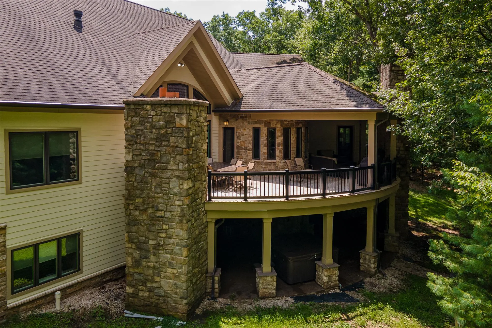 Wide aerial view of the Deep Creek Lake area with Woodland Chalet among wooded hillside