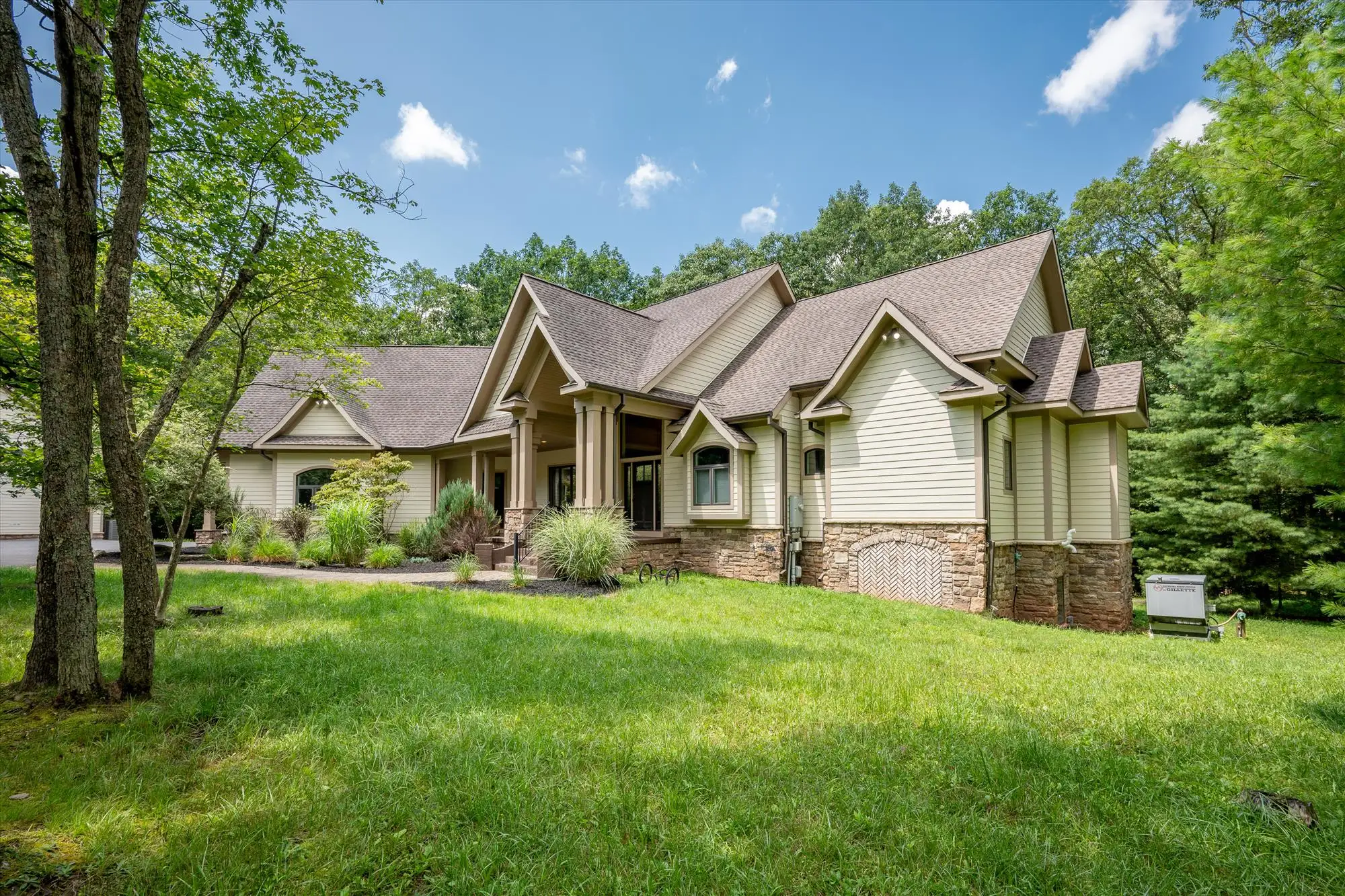Woodland Chalet exterior at dusk, an 8-bedroom mountain estate at Deep Creek Lake