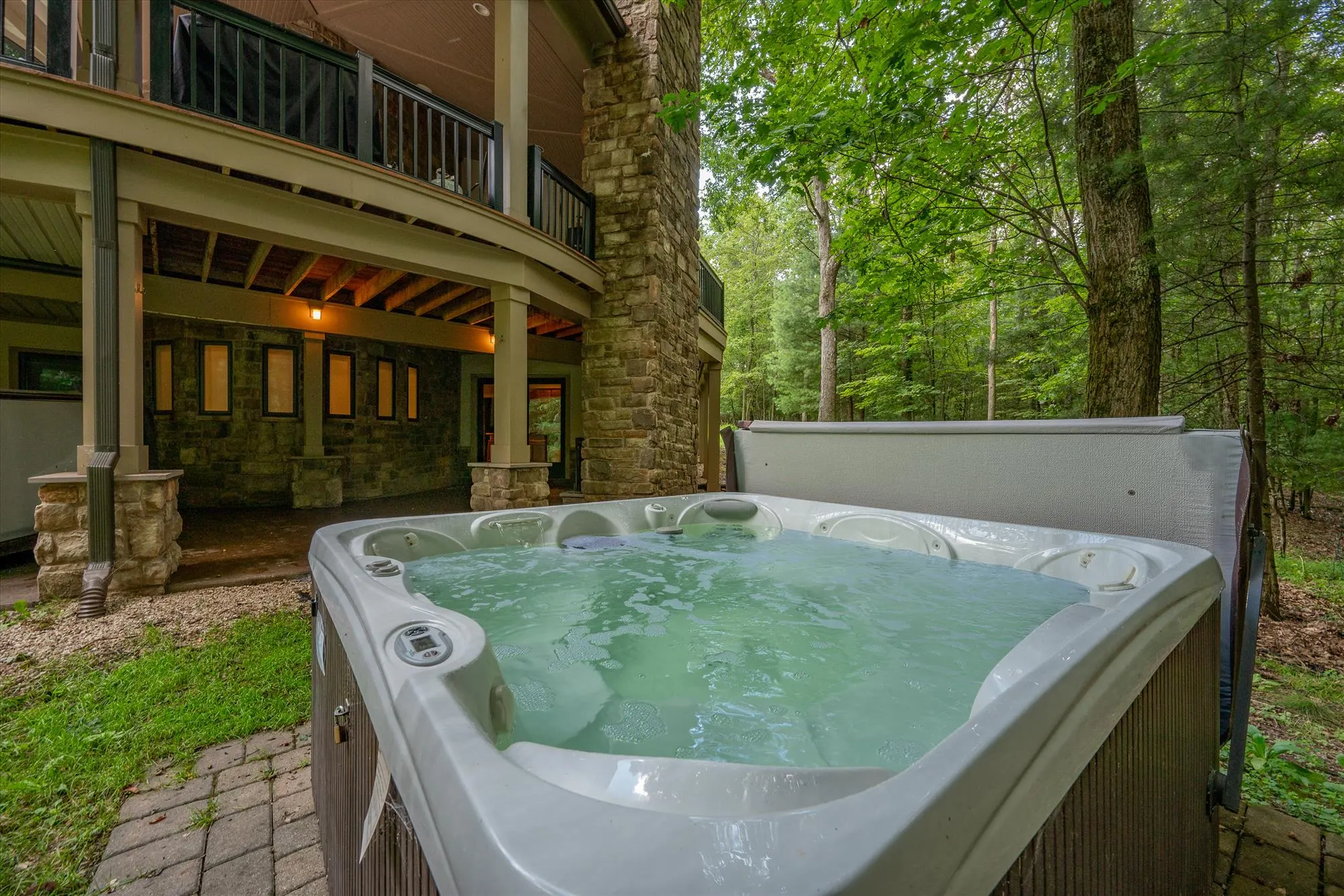 Second outdoor hot tub on the patio level at Woodland Chalet