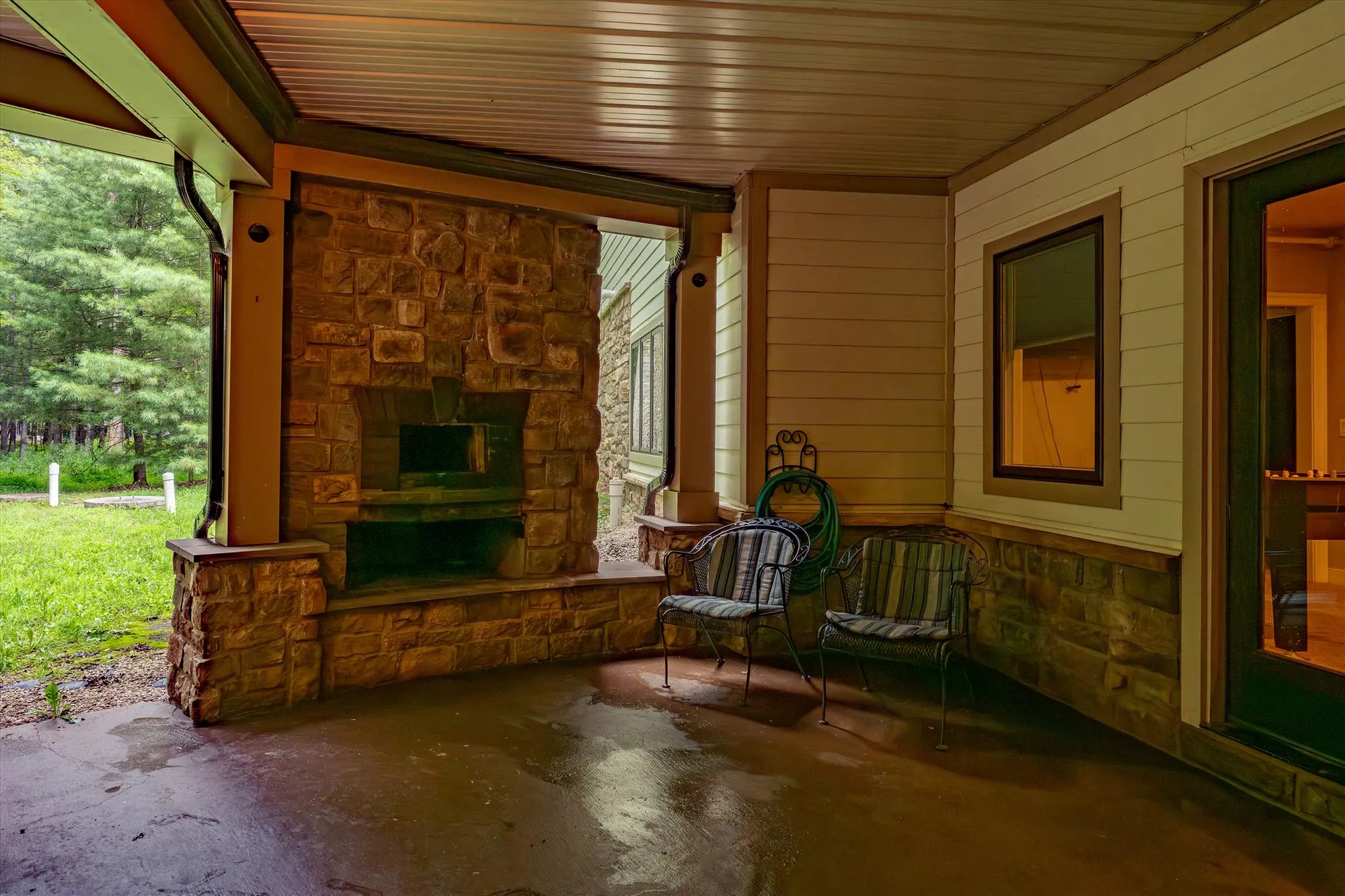 Lower level patio with outdoor seating and access to the hot tubs