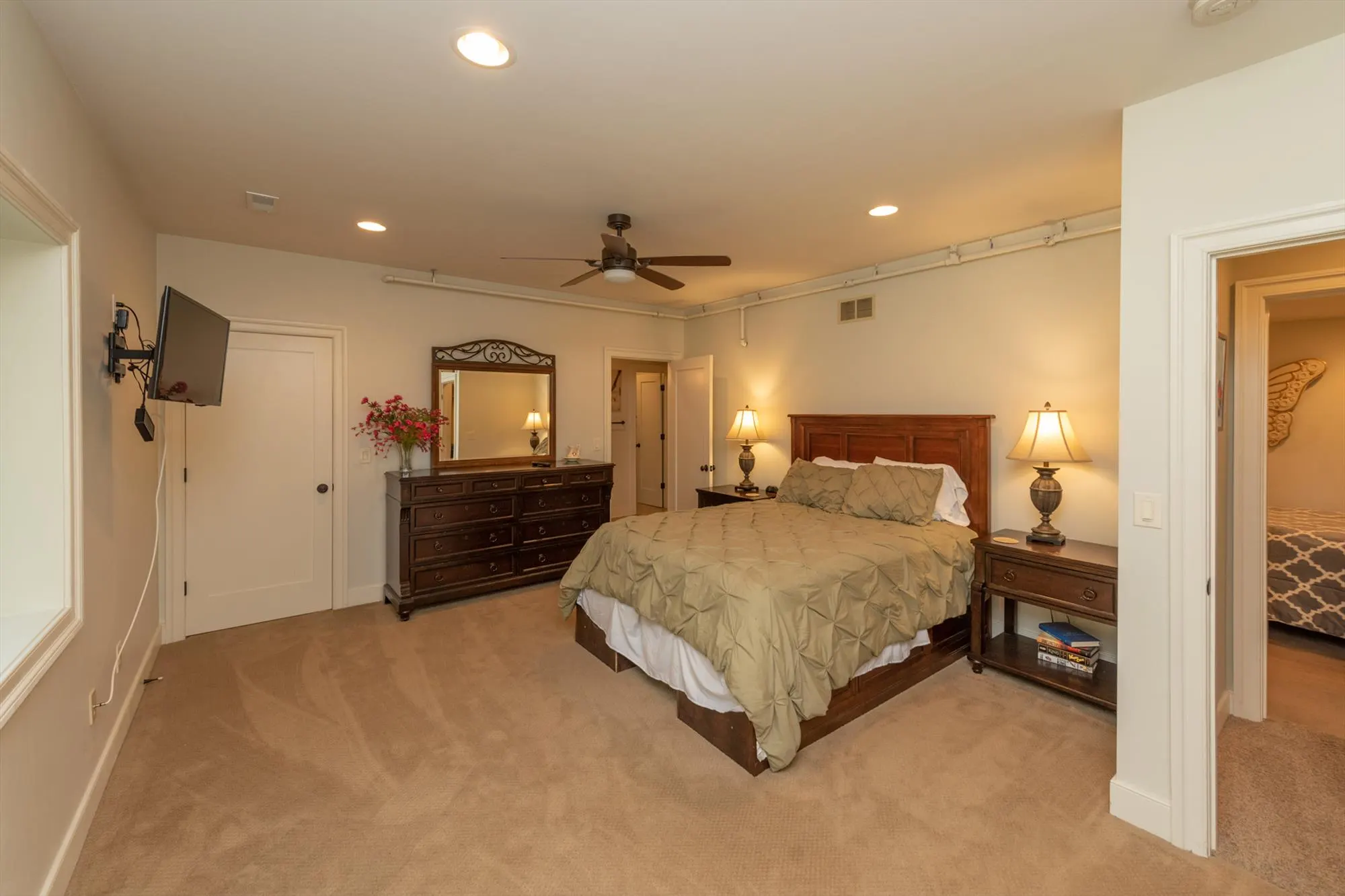 Lower level bedroom with queen bed and cozy mountain cabin feel