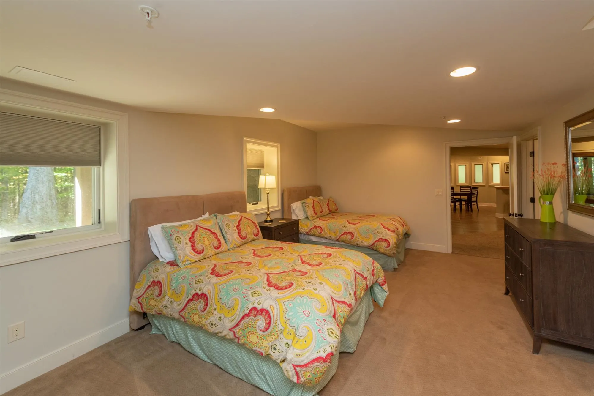Lower level primary suite additional view showing spacious bedroom area