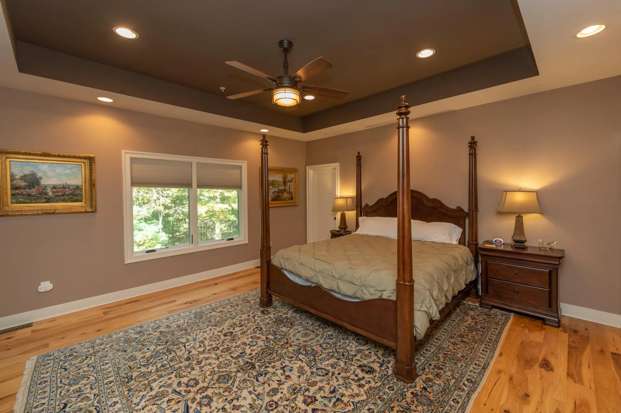Primary suite sitting area with private wet bar and spacious layout