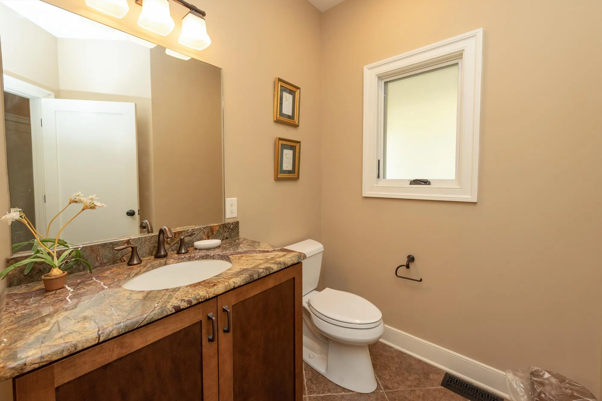 Main level powder room for convenient guest use
