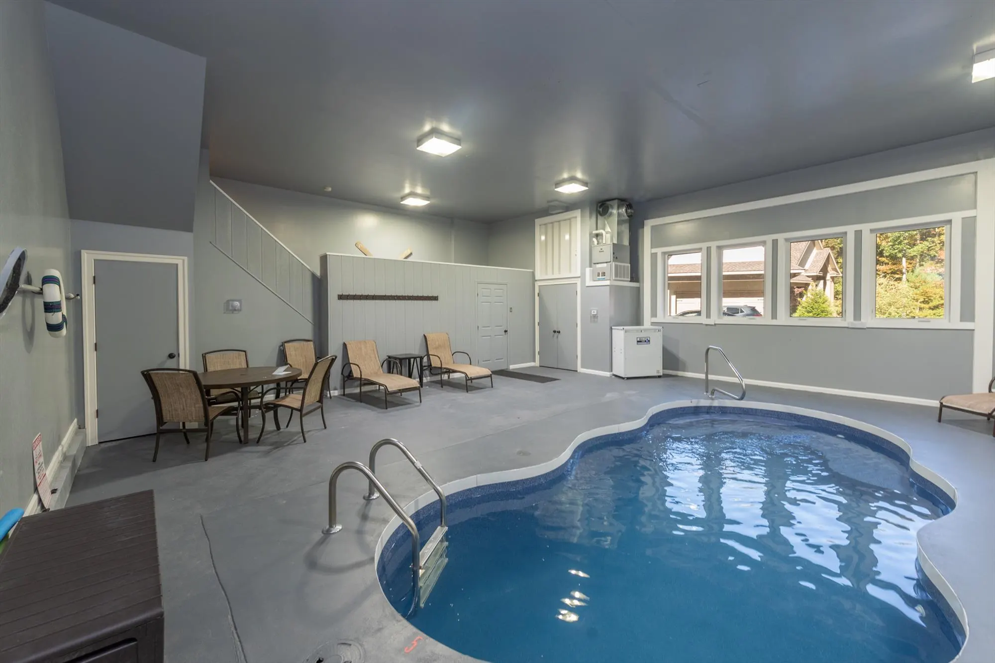 Private heated indoor pool in the dedicated pool house at Woodland Chalet