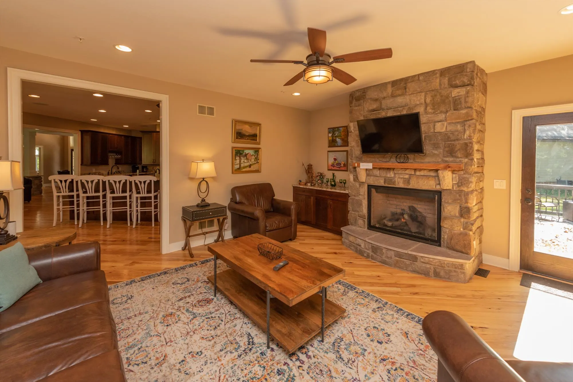 Family room area with plush seating and warm lighting at Woodland Chalet
