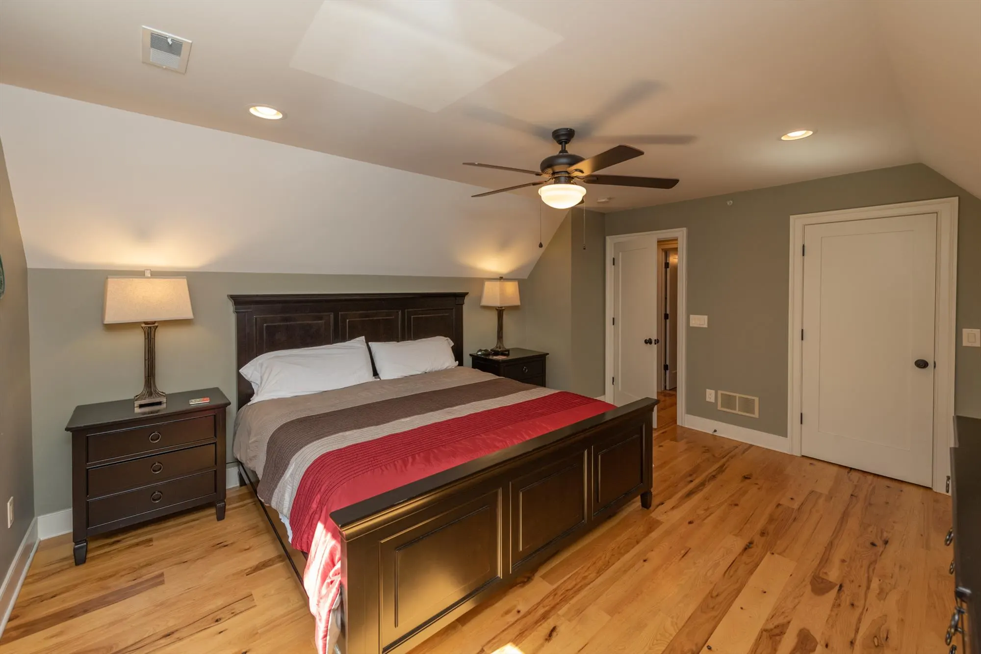 Upper level bedroom with king bed and mountain retreat atmosphere